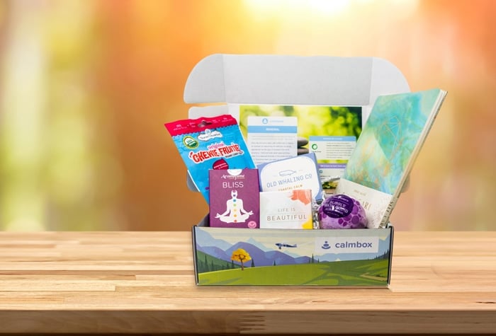 a calmbox, card set, bath salts, a bracelet, selenite and palo santo, tea, and lotion